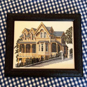 Cross stitch picture with house and beautiful frame